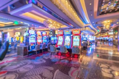 inatogel online slot games on mobile phone with live blackjack table in background